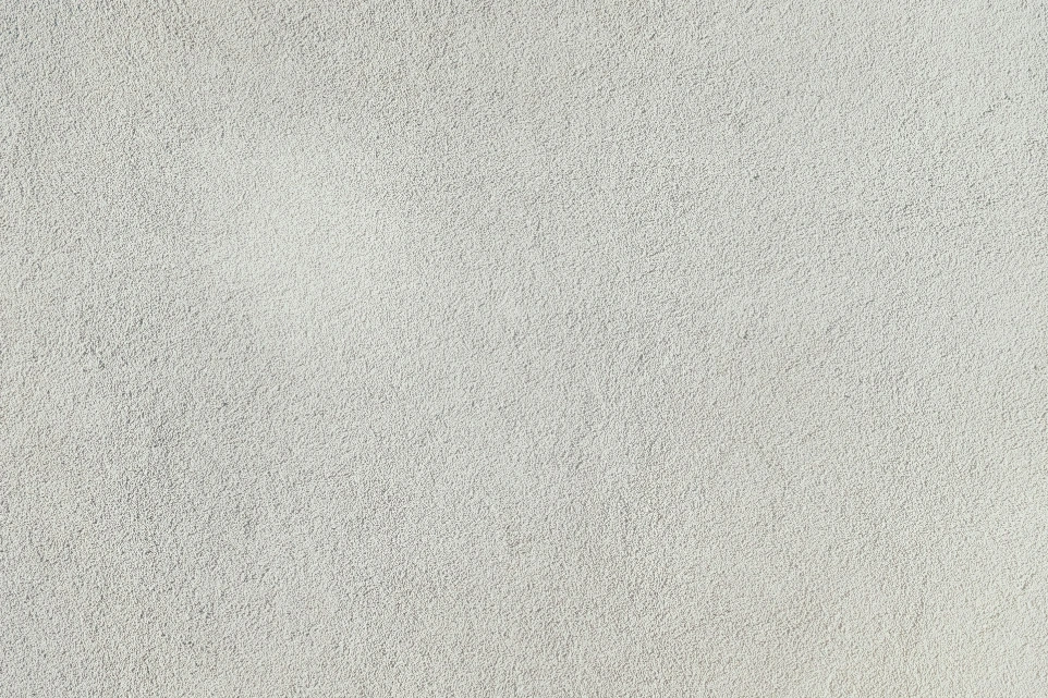 a close up of a white stucco wall